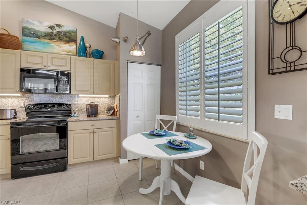 9001 Springview Loop Estero, FL 33928 - Photo 10 of 50 a kitchen with a sink cabinets and counter space