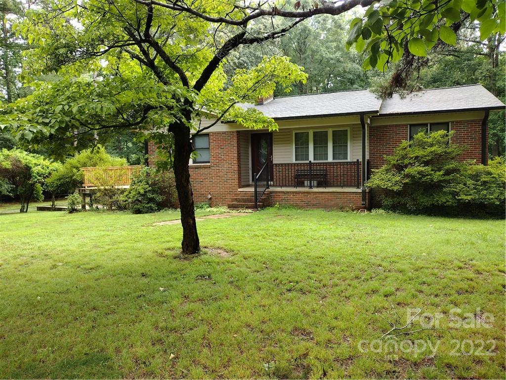 2413 Dan Reel Road Denver, NC 28037 - Photo 26 of 26 a front view of a house with garden