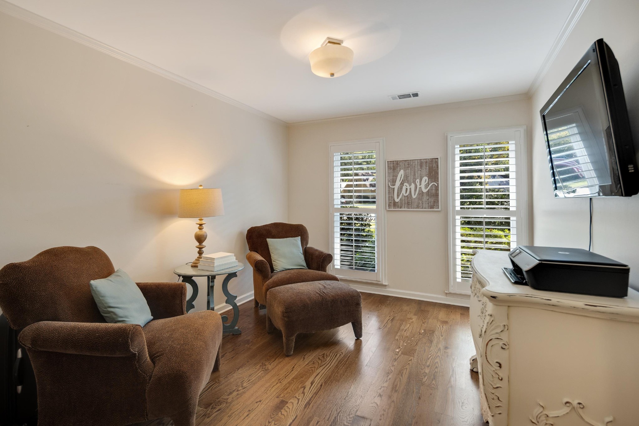 8774 Yorkchester Road Memphis, TN 38139 - Photo 12 of 23 a living room with furniture and a flat screen tv