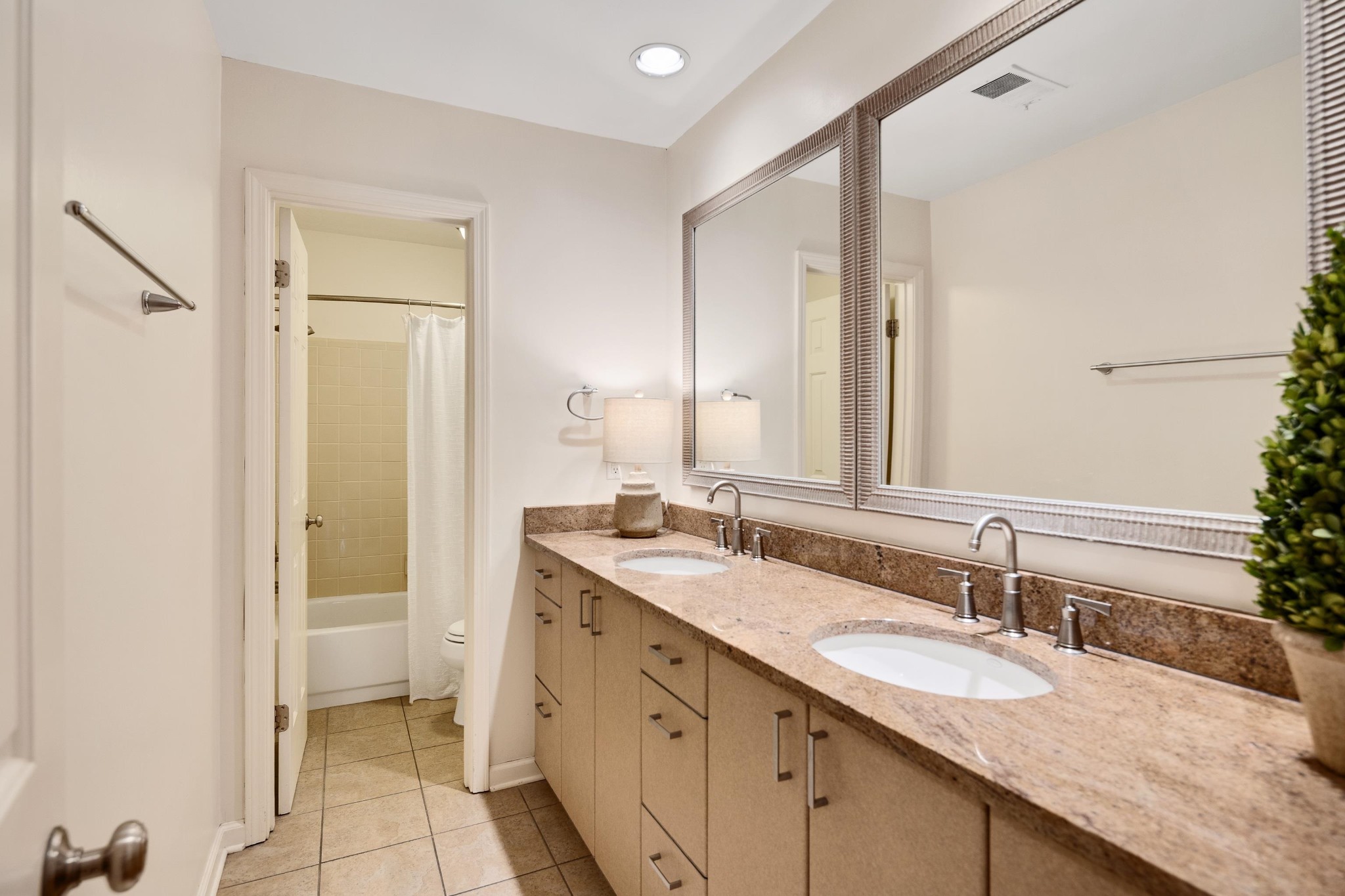 8774 Yorkchester Road Memphis, TN 38139 - Photo 13 of 23 a bathroom with a granite countertop sink and a mirror