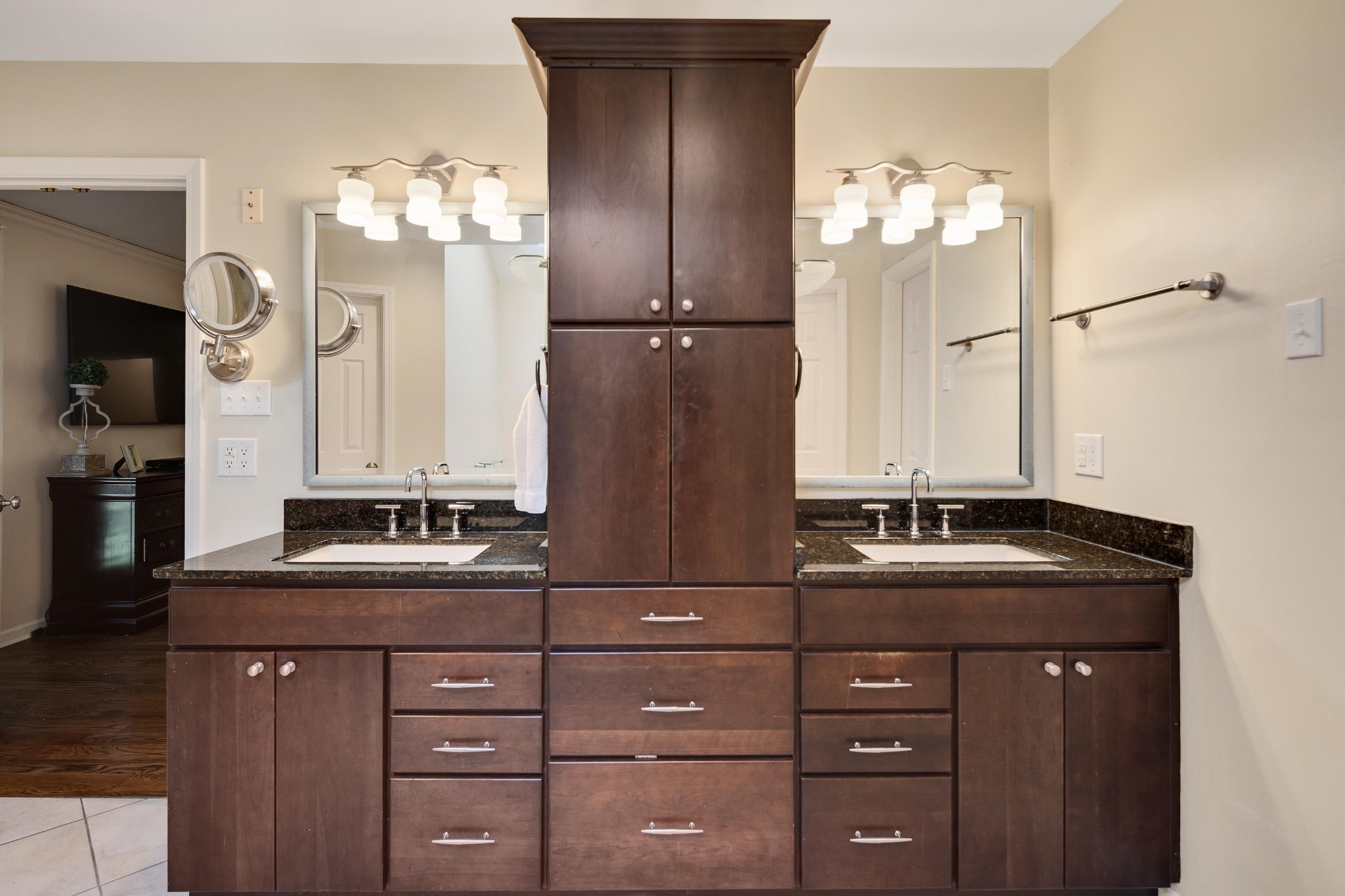 8774 Yorkchester Road Memphis, TN 38139 - Photo 17 of 23 a bathroom with a granite countertop sink a large mirror and a shower