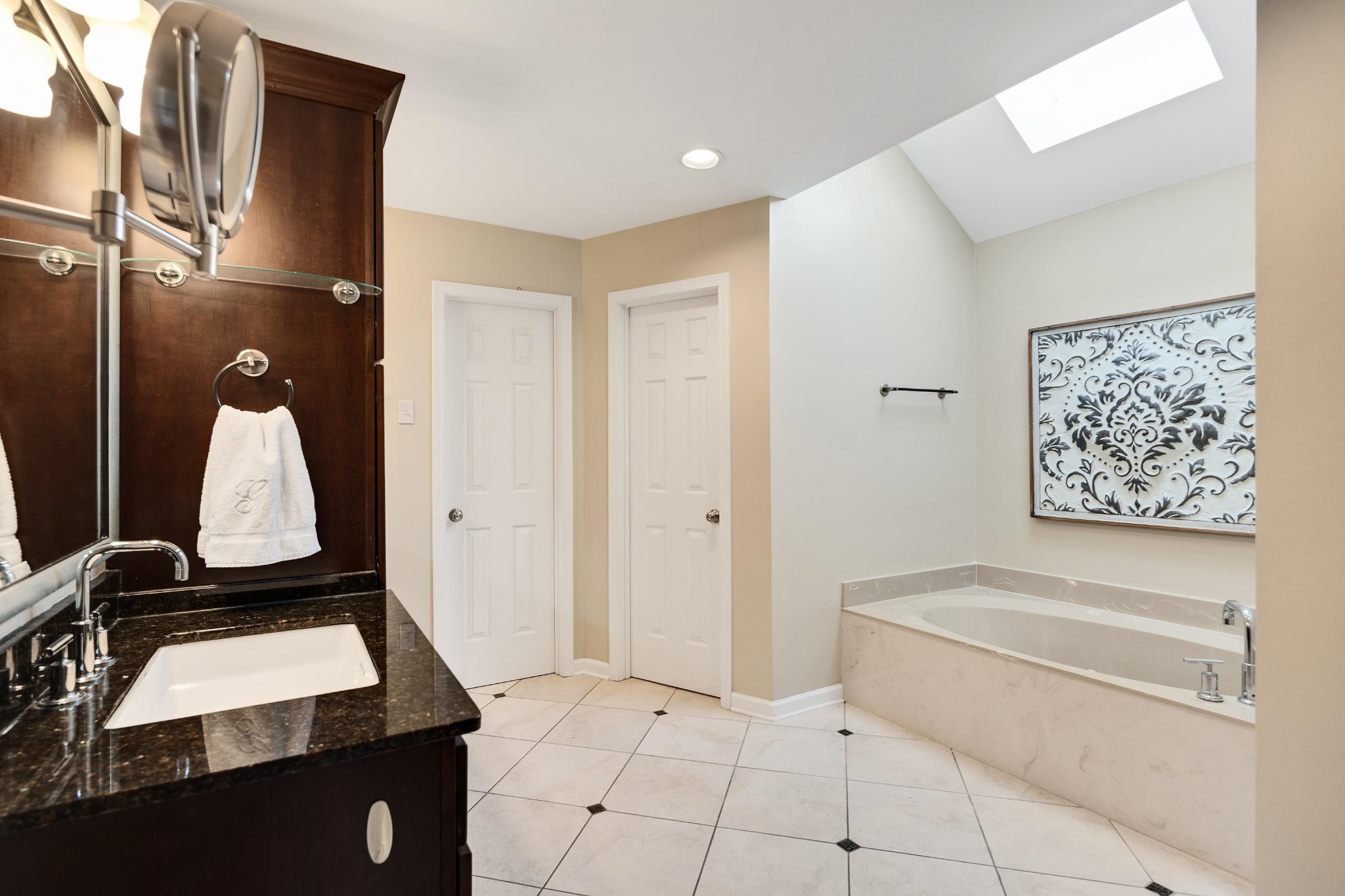 8774 Yorkchester Road Memphis, TN 38139 - Photo 18 of 23 a bathroom with a tub sink and vanity