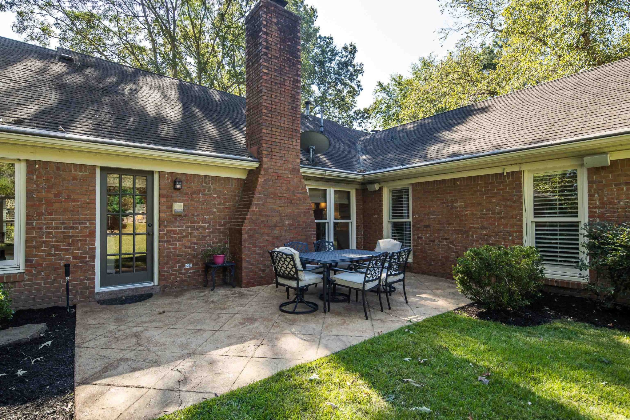 8774 Yorkchester Road Memphis, TN 38139 - Photo 20 of 23 a view of house with backyard and outdoor seating