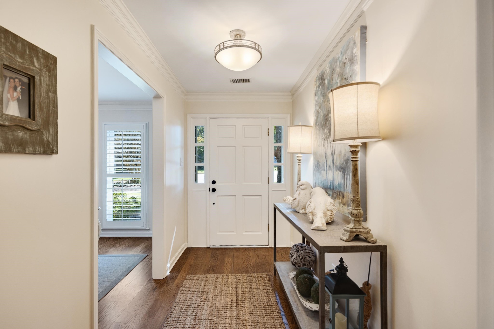 8774 Yorkchester Road Memphis, TN 38139 - Photo 2 of 23 a view of hallway with cabinets and wooden floor