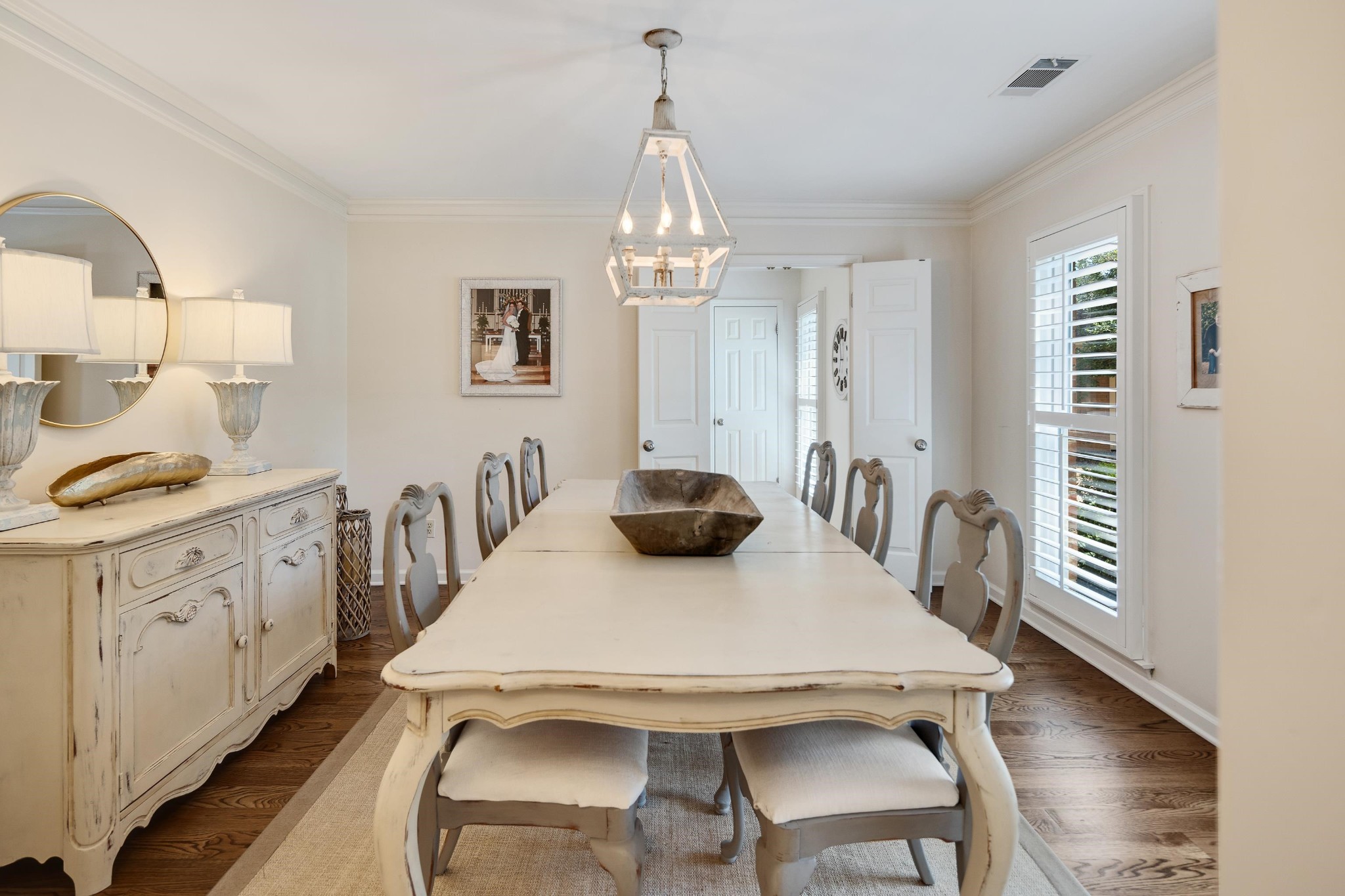 8774 Yorkchester Road Memphis, TN 38139 - Photo 3 of 23 a kitchen with stainless steel appliances granite countertop a dining table chairs and a refrigerator