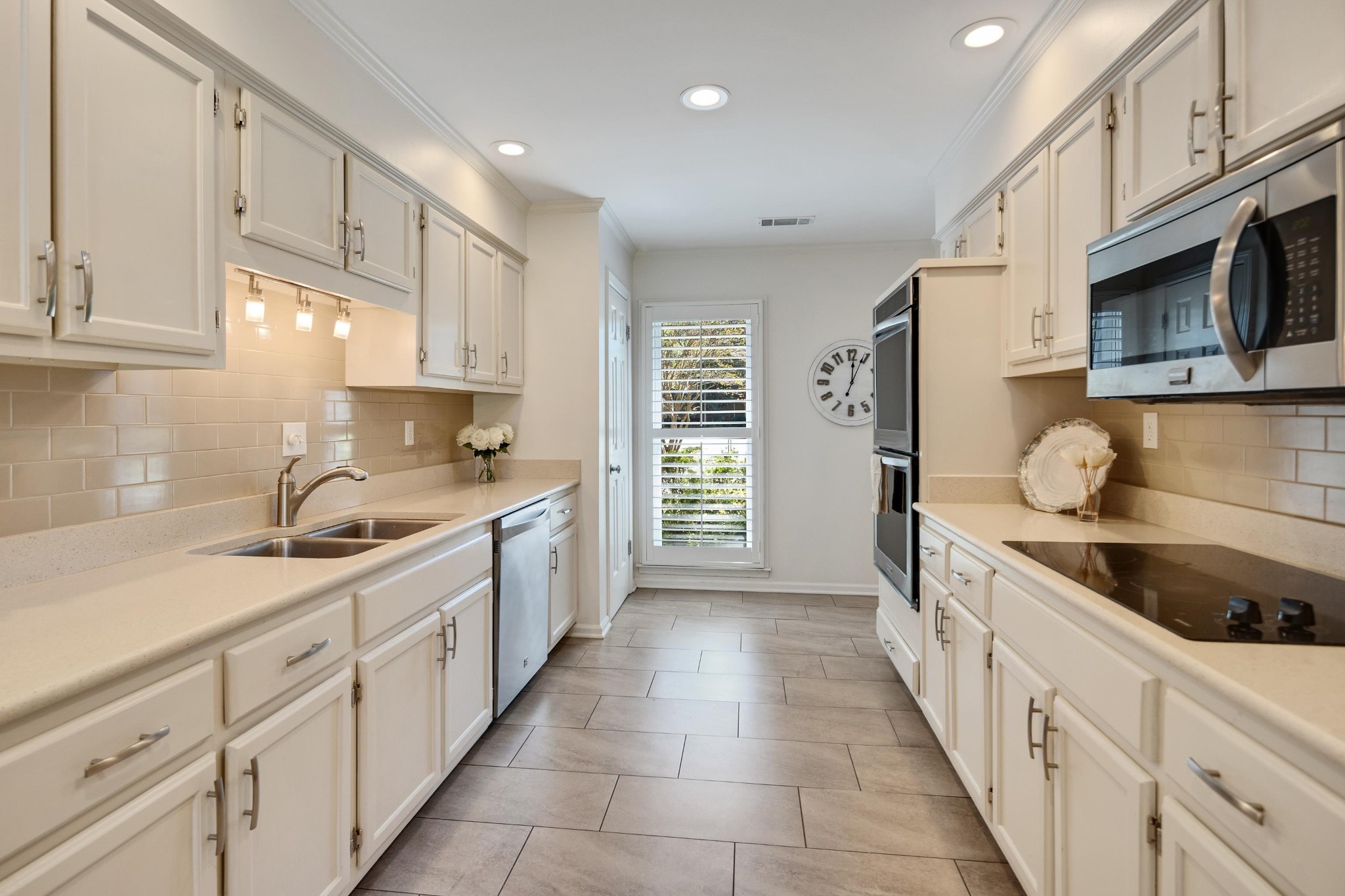 8774 Yorkchester Road Memphis, TN 38139 - Photo 5 of 23 a kitchen with granite countertop cabinets stainless steel appliances and a sink