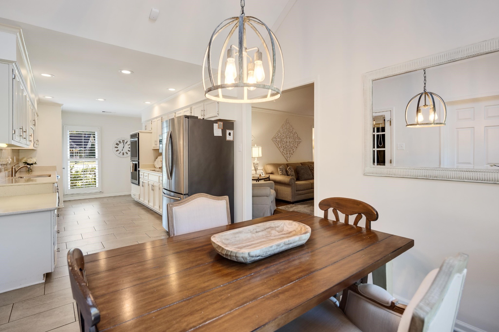 8774 Yorkchester Road Memphis, TN 38139 - Photo 7 of 23 a view of a dining room with furniture a chandelier and wooden floor