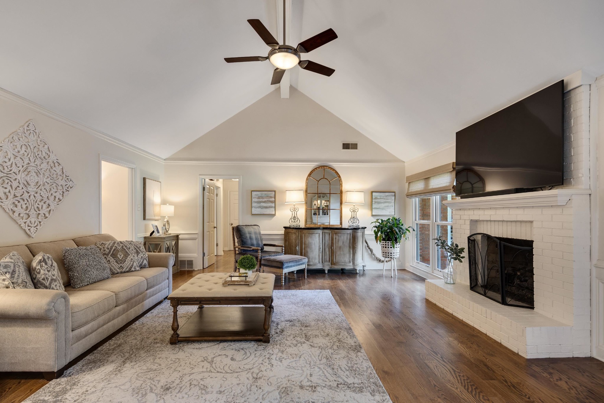 8774 Yorkchester Road Memphis, TN 38139 - Photo 8 of 23 a living room with fireplace furniture and a flat screen tv