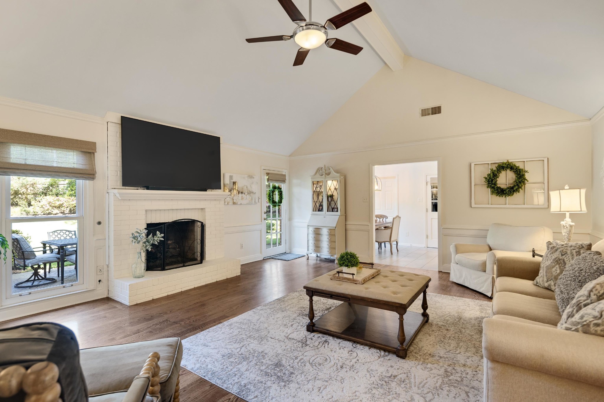 8774 Yorkchester Road Memphis, TN 38139 - Photo 9 of 23 a living room with furniture a fireplace and a flat screen tv