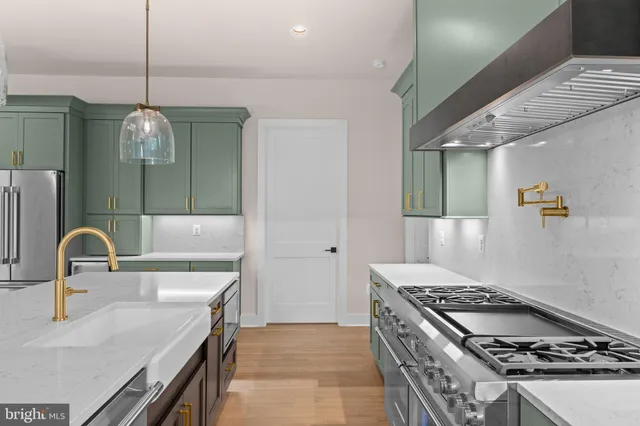 a kitchen with a sink and a window