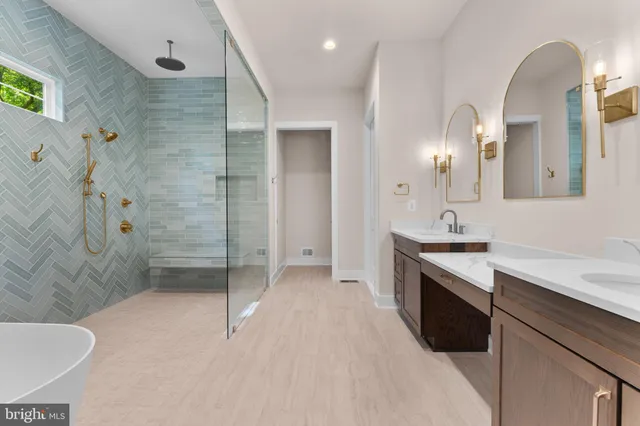 a bathroom with 2 sink and a mirror