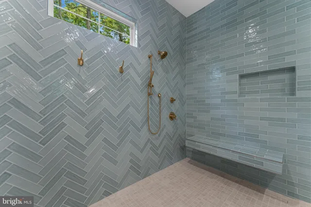 a bathroom with a tub a sink and mirror