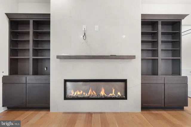 a view of kitchen and hall with wooden floor