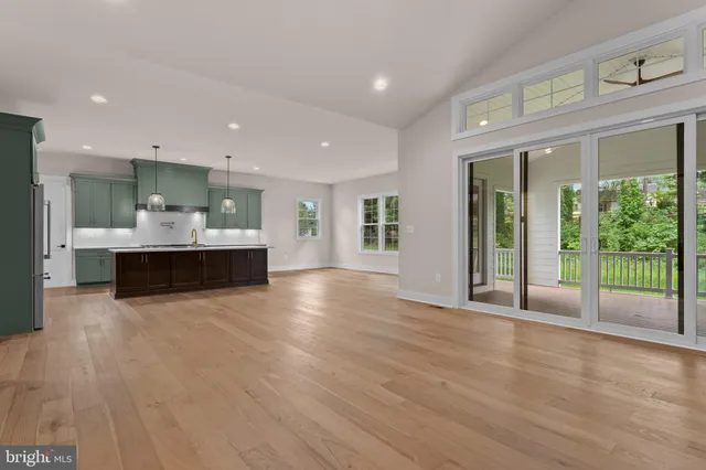 a kitchen with a stove sink and refrigerator