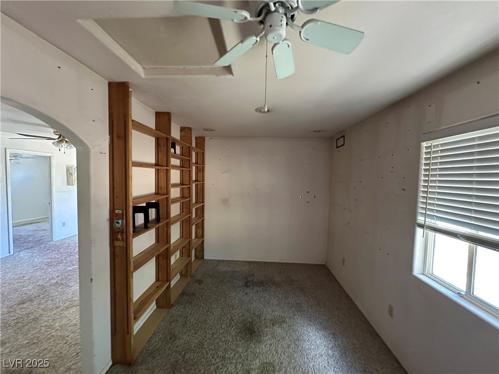 336 Hoffman Street Pioche, NV 89043 - Photo 26 of 36 Unfurnished room with a ceiling fan, carpet floors, and arched walkways