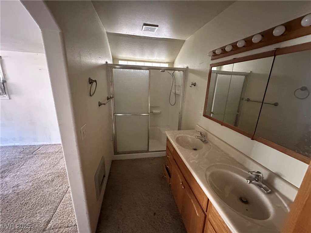 336 Hoffman Street Pioche, NV 89043 - Photo 31 of 36 Bathroom featuring double vanity and a shower stall