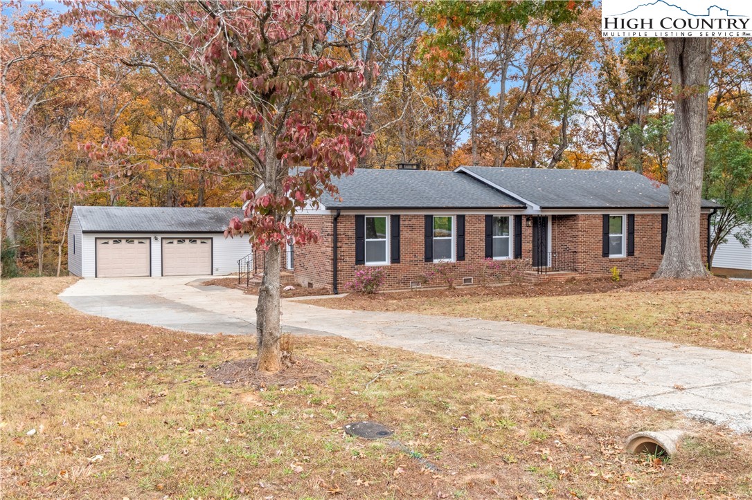765 Laverton Lane Rural Hall, NC 27045 - Photo 1 of 41 a front view of a house with a yard and garage