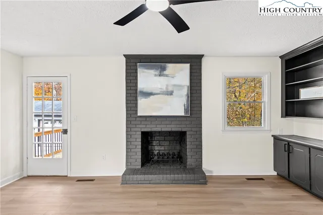 a kitchen with stainless steel appliances granite countertop a sink and a stove