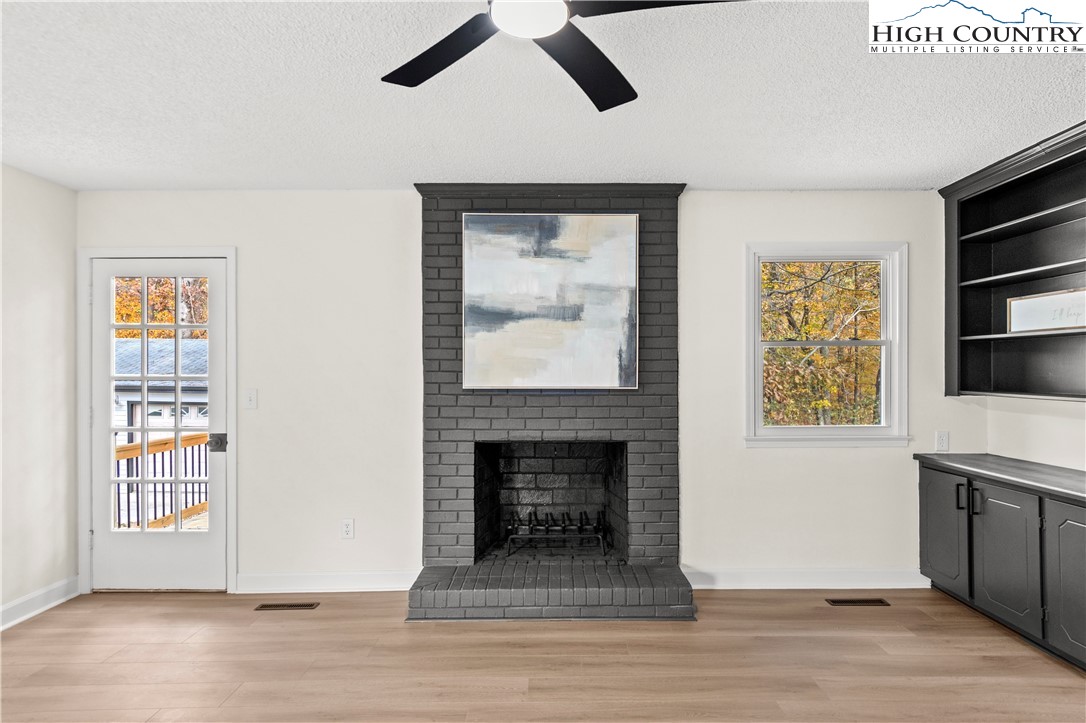 765 Laverton Lane Rural Hall, NC 27045 - Photo 13 of 41 a living room with furniture and a fireplace