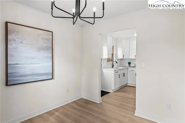 a kitchen with stainless steel appliances a refrigerator sink and stove