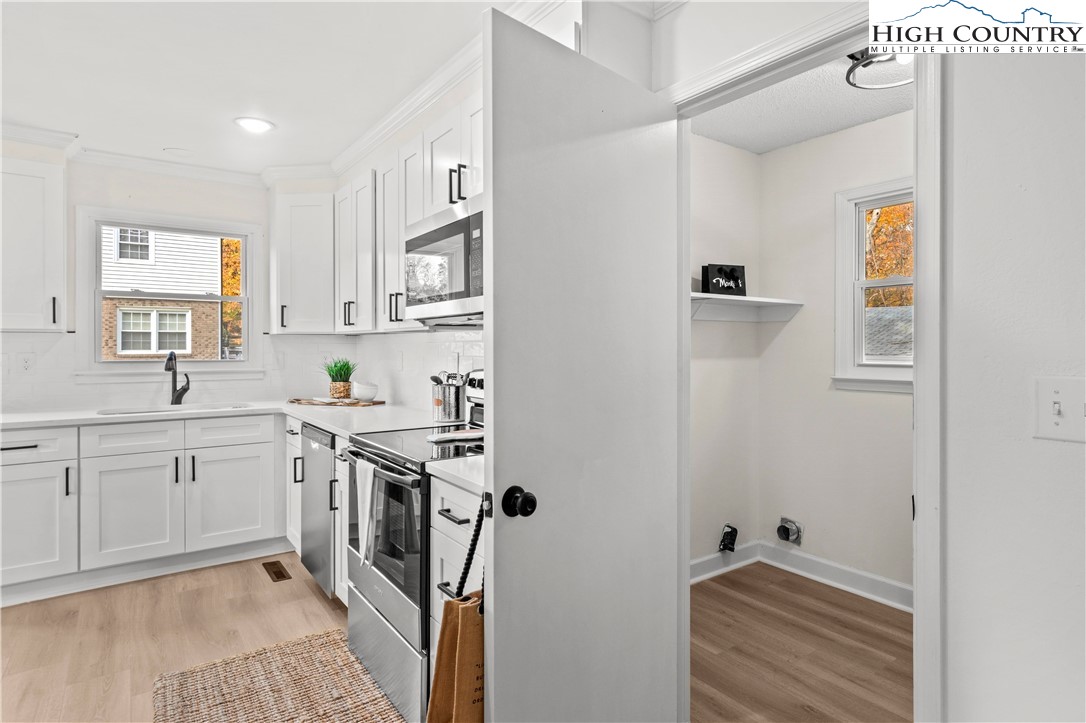 765 Laverton Lane Rural Hall, NC 27045 - Photo 20 of 41 a kitchen with cabinets and window