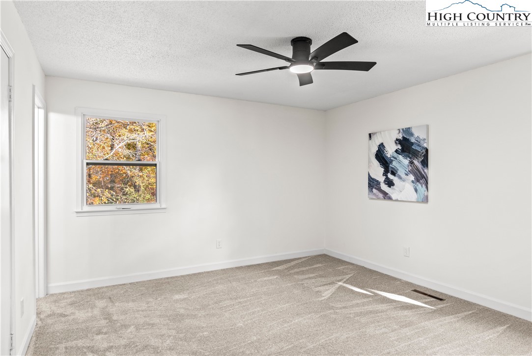 765 Laverton Lane Rural Hall, NC 27045 - Photo 24 of 41 an empty room with window and ceiling fan