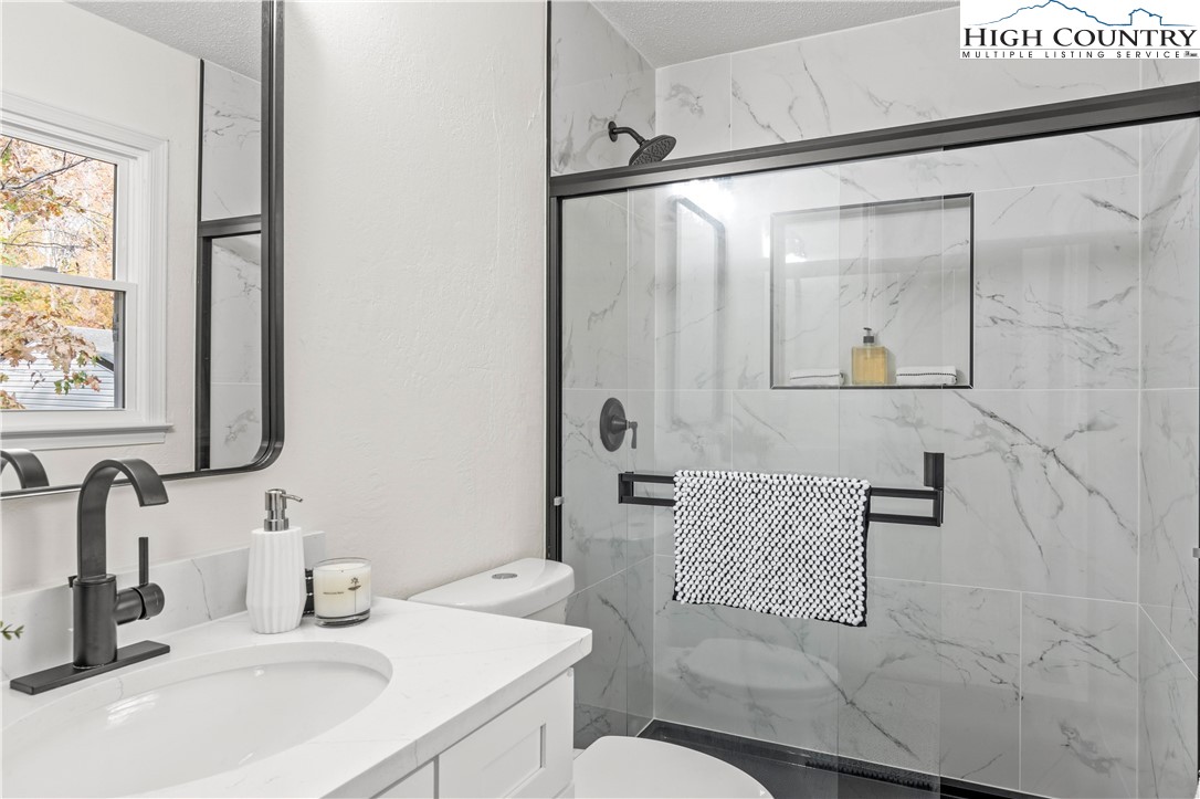 765 Laverton Lane Rural Hall, NC 27045 - Photo 27 of 41 a bathroom with a sink toilet and shower