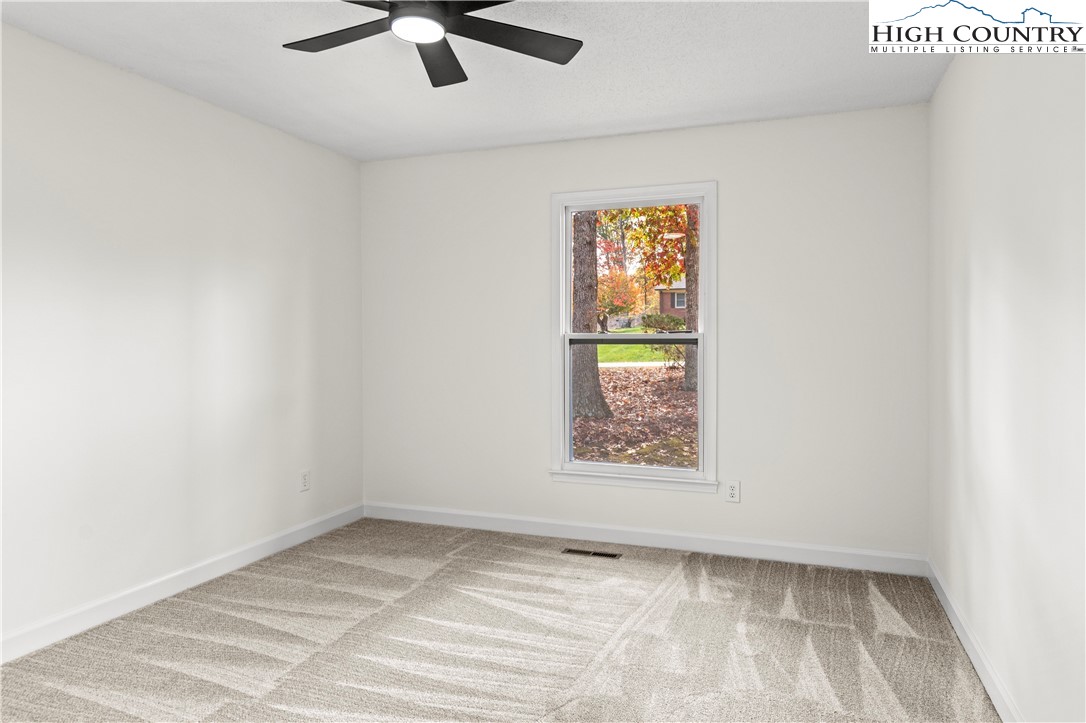 765 Laverton Lane Rural Hall, NC 27045 - Photo 28 of 41 an empty room with a window and a ceiling fan