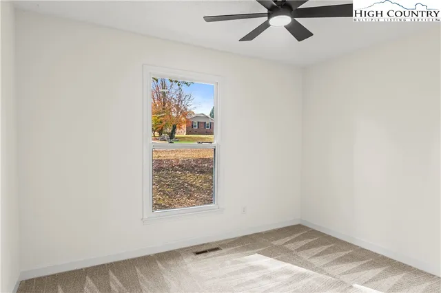 a view of a room with wooden walls