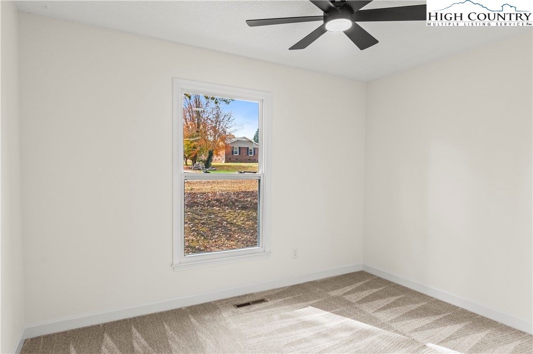 765 Laverton Lane Rural Hall, NC 27045 - Photo 30 of 41 an empty room with window and ceiling fan