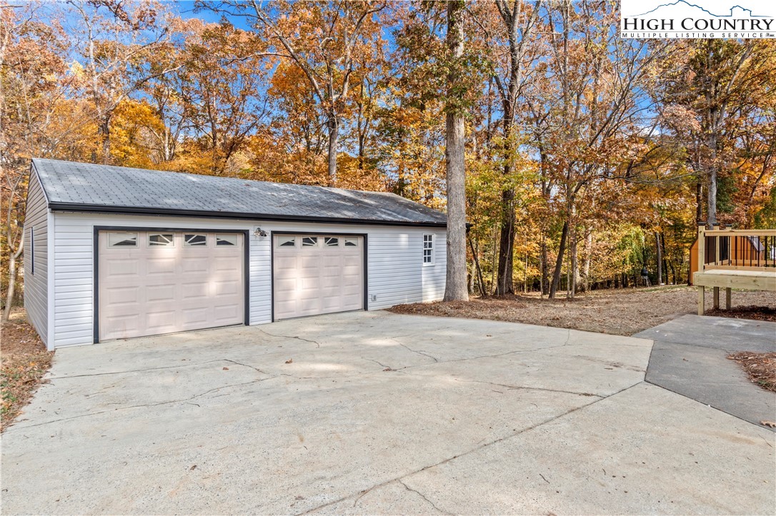 765 Laverton Lane Rural Hall, NC 27045 - Photo 34 of 41 a front view of a house with a garden and trees
