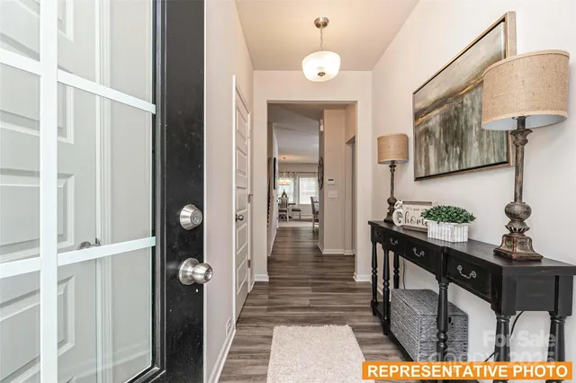a view of a hallway and dining room