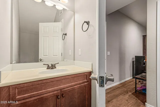 a bathroom with a sink and a mirror