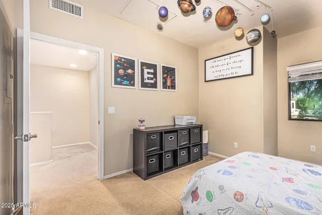 a bedroom with a bed and cabinets