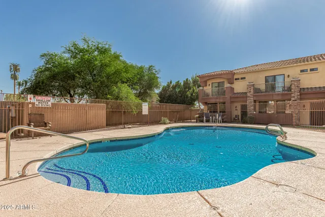 a view of a swimming pool with a lounge chairs