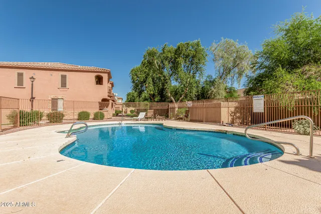 a view of a swimming pool with a patio