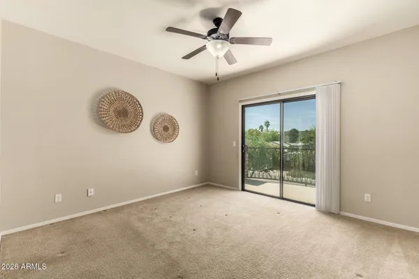 a view of an empty room with a fan