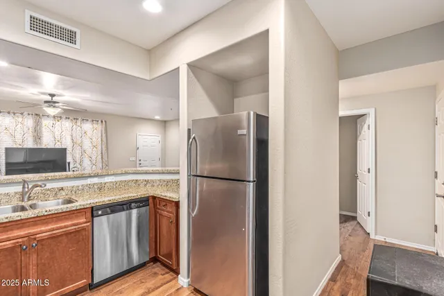 a white refrigerator freezer sitting inside of a kitchen