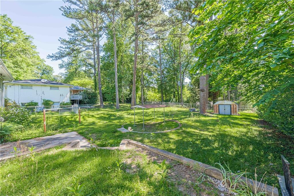 1502 North Druid Hills Road Brookhaven, GA 30319 - Photo 42 of 46 a view of a backyard with garden
