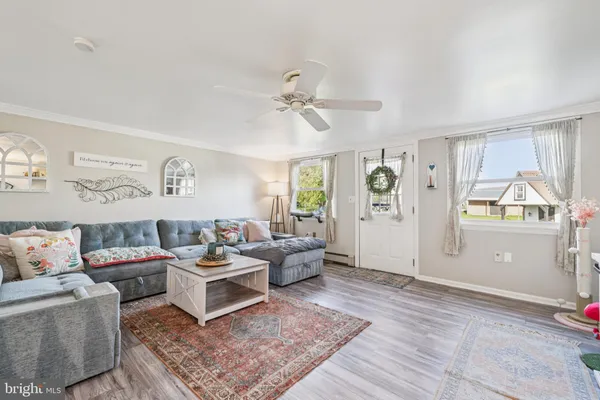 a living room with furniture and a rug