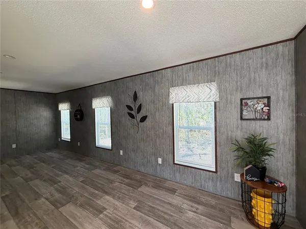 a view of an entryway with wooden floor