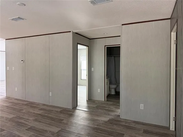 a view of a small space with wooden floor