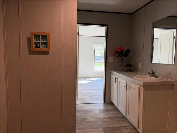 a kitchen with a sink and a refrigerator