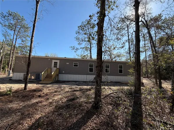a view of a backyard of the house