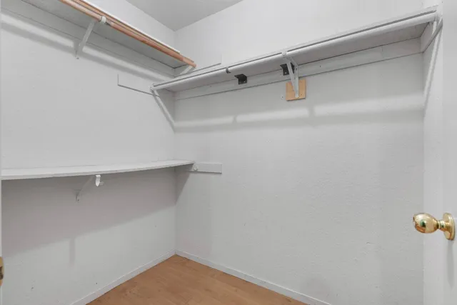 a view of an empty walk in closet
