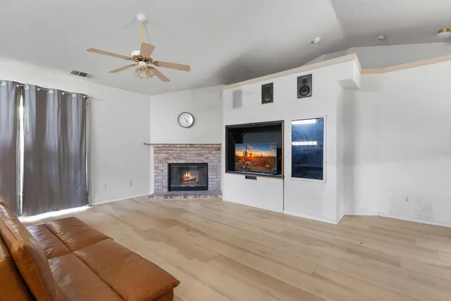 a view of an empty room with a fireplace