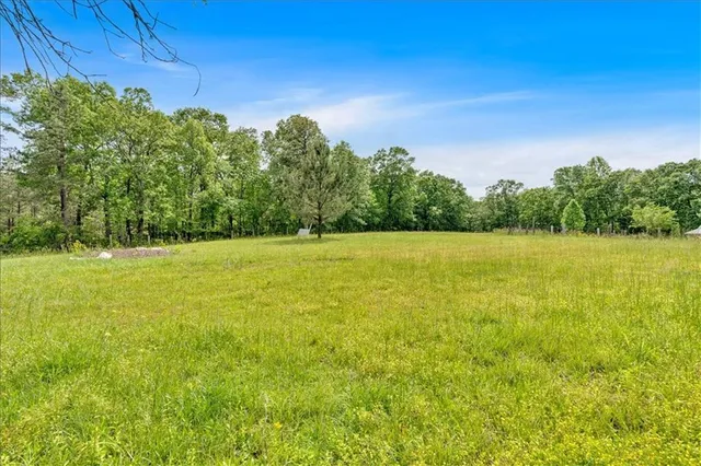 a view of a field with an outdoor space