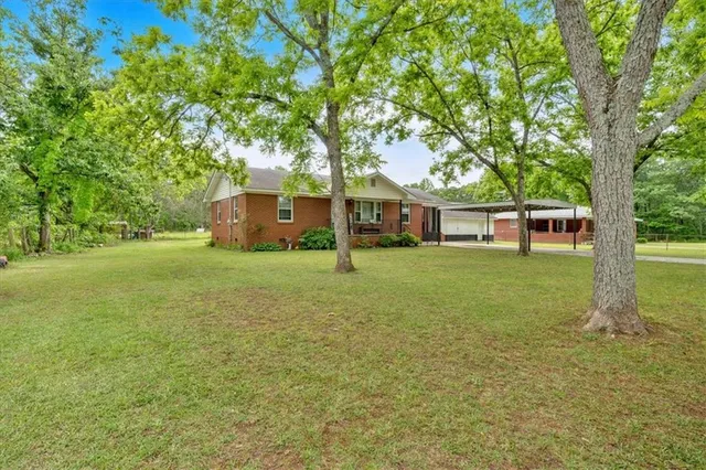 front view of a house with a big yard