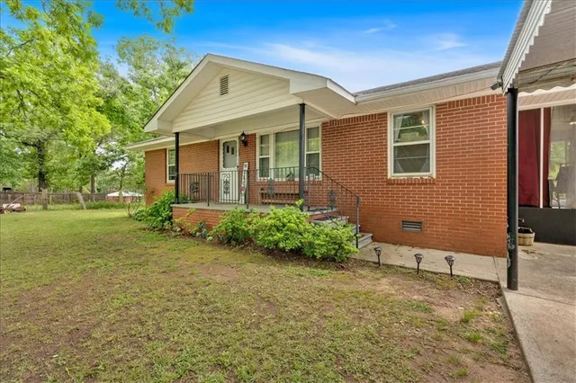 a front view of a house with garden