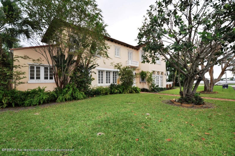 245 Valencia Road West Palm Beach, FL 33401 - Photo 2 of 19 a view of a house with backyard and garden